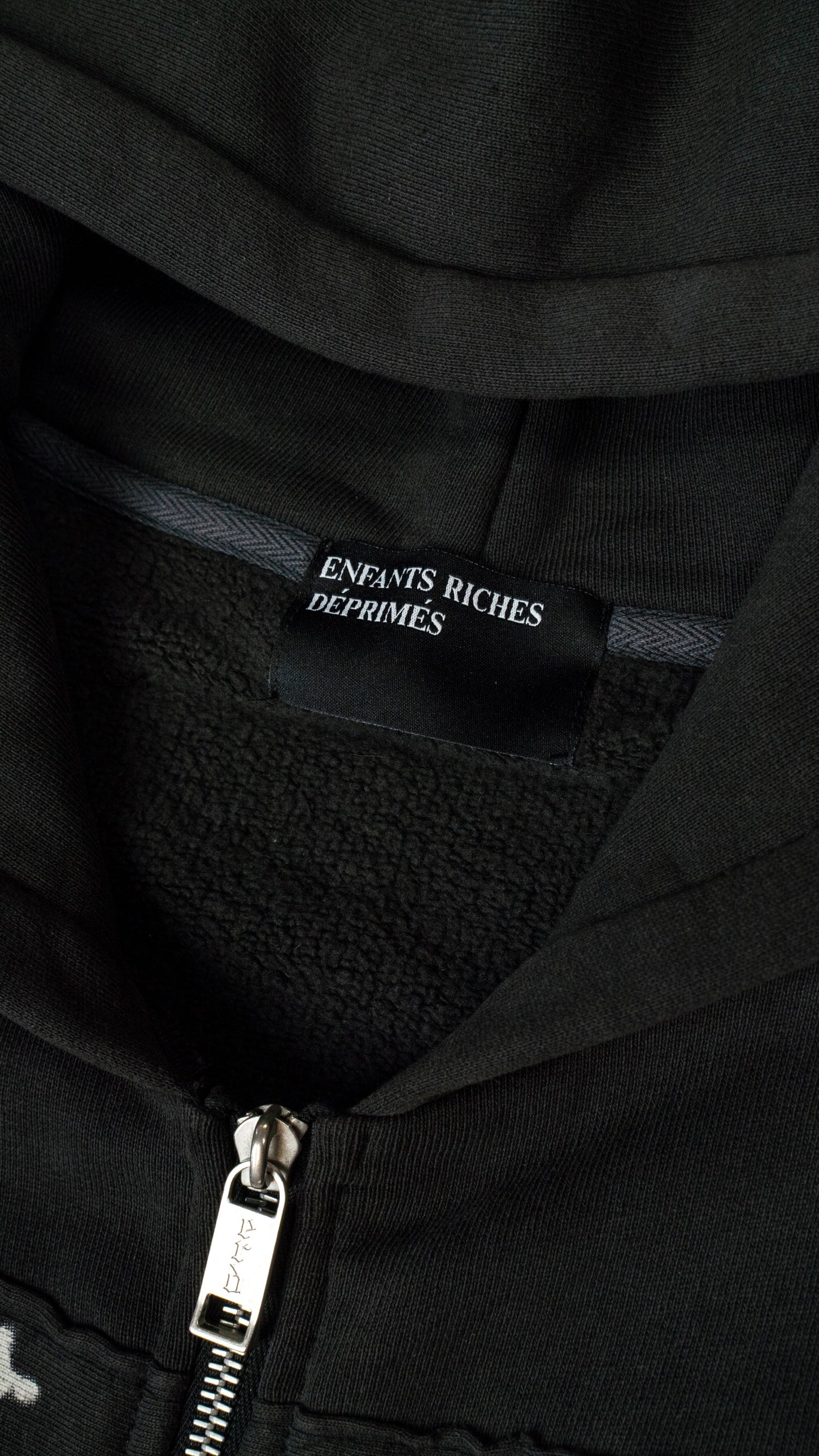 Artist Defends Baggy Assemblage Zip Up Hoodie