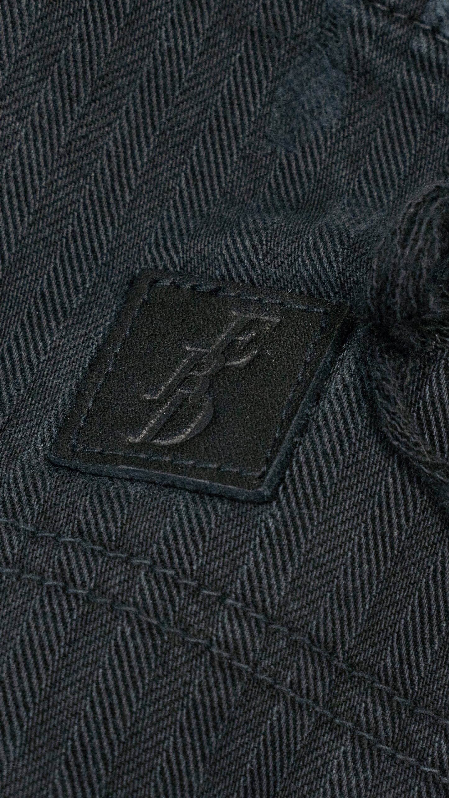 Straight-Leg Distressed Paneled Herringbone Denim Trousers