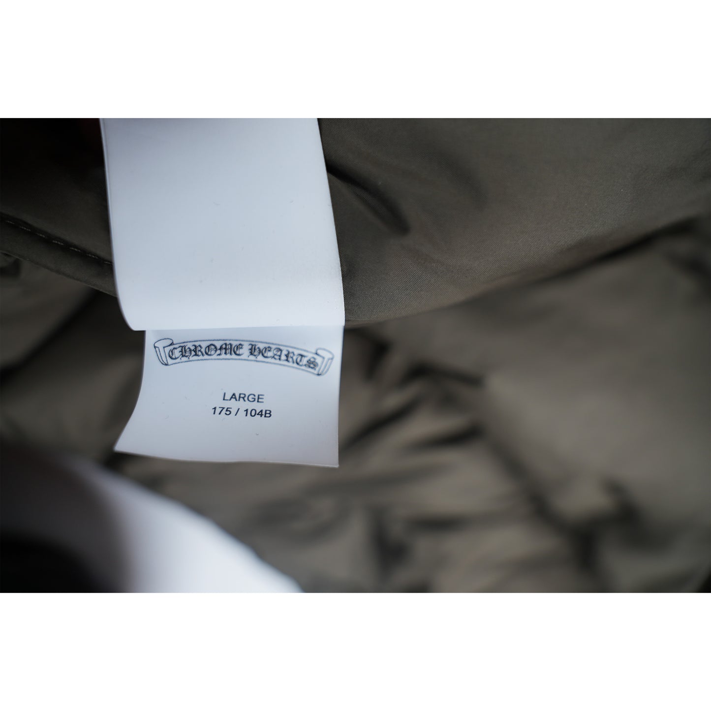 Olive Monogram Cross Puffer Down Jacket